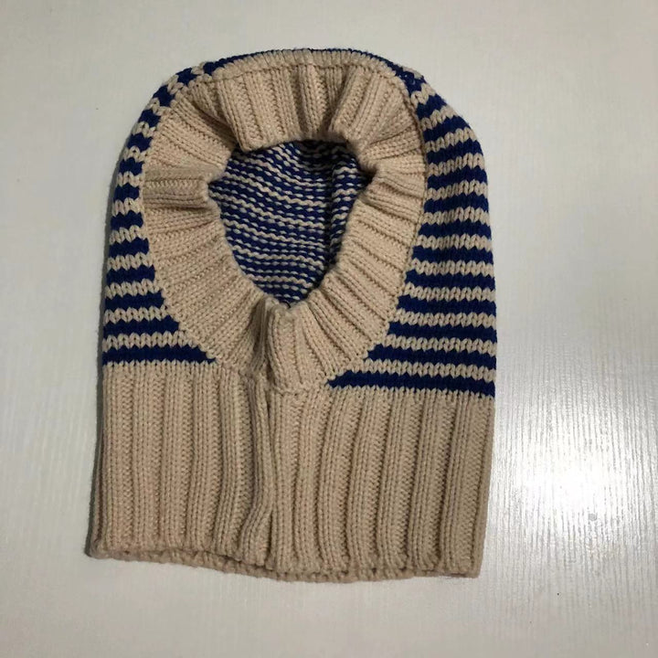 Person wearing striped knitted balaclava hood