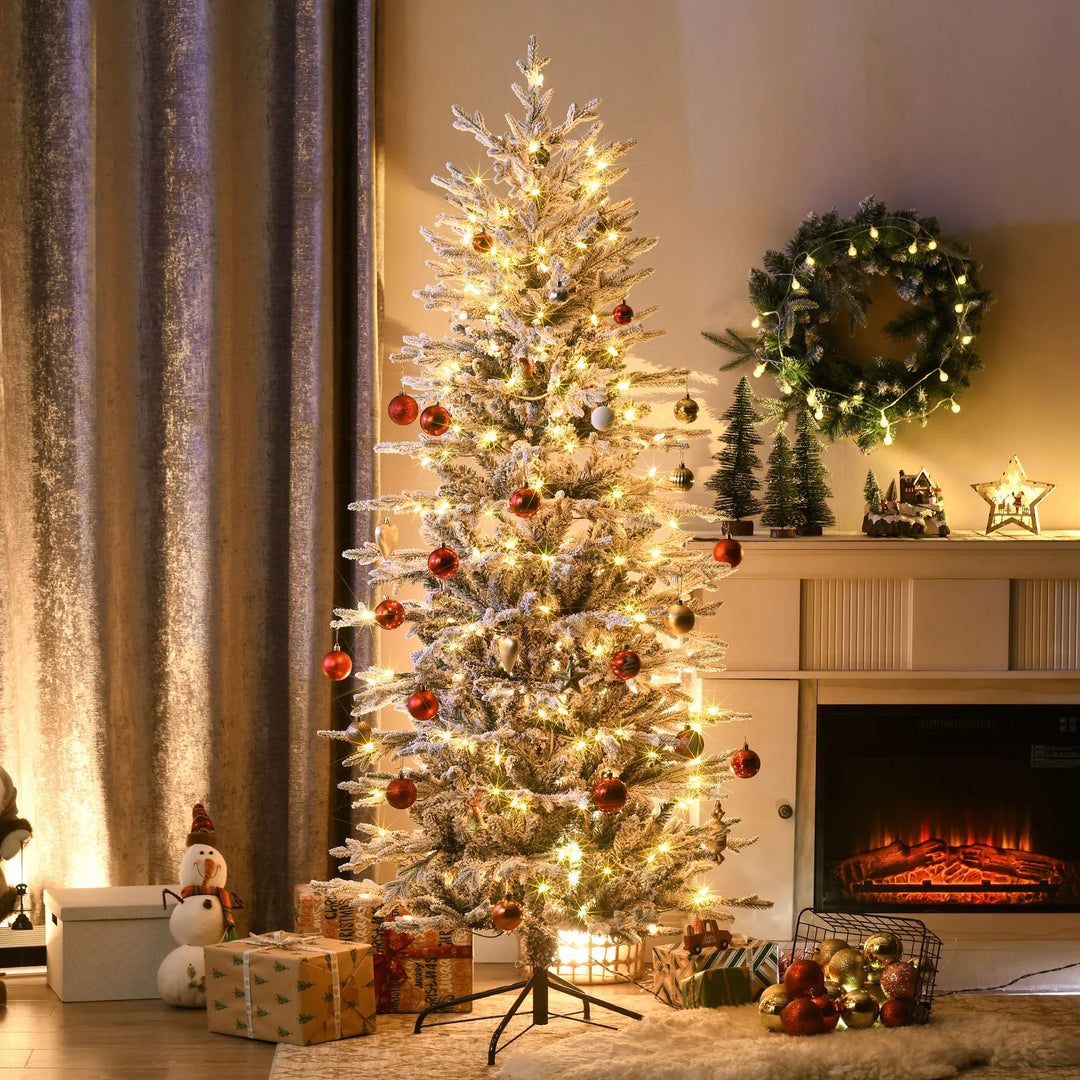 Snow-flocked tree with clear warm lights