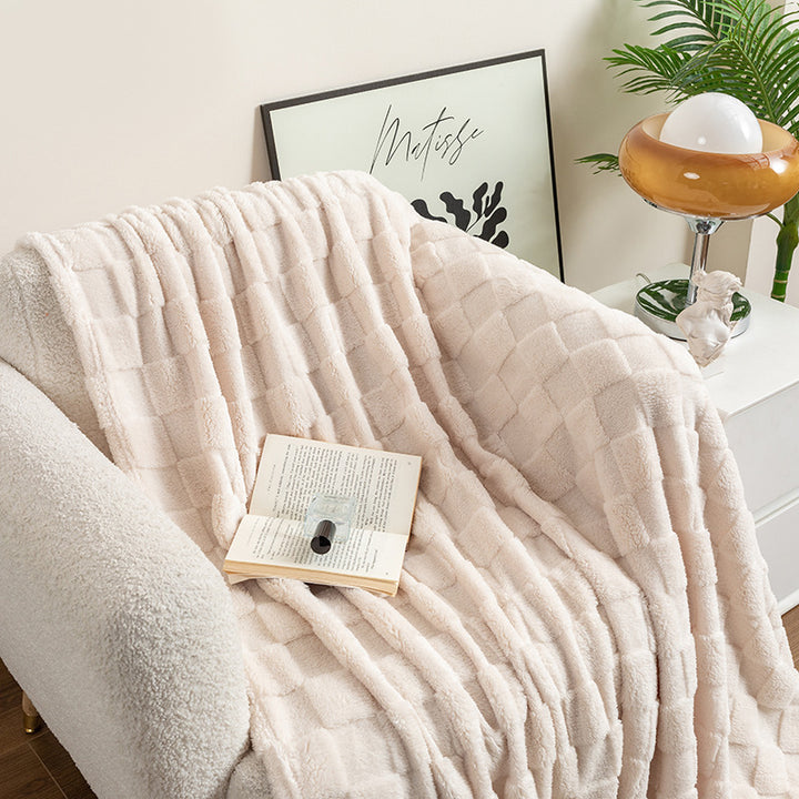 Cream checked plush throw blanket on sofa