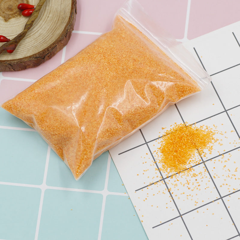 Coloured magic sand shaped underwater
