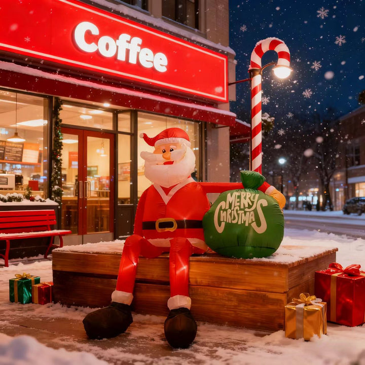 Giant inflatable Santa with gift sack in garden