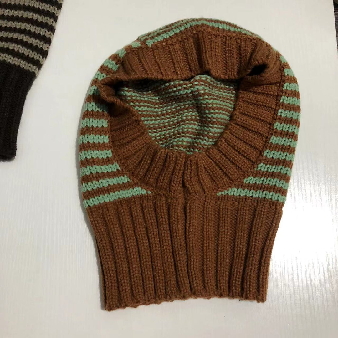 Person wearing striped knitted balaclava hood