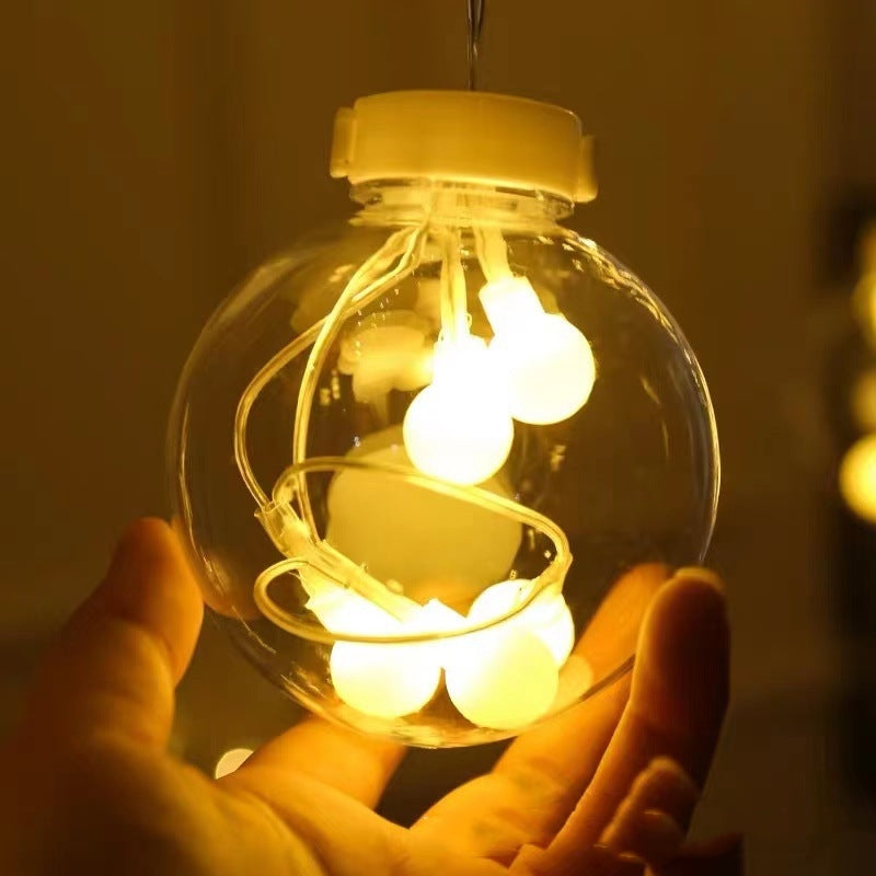 Warm white LED orb curtain lights in window