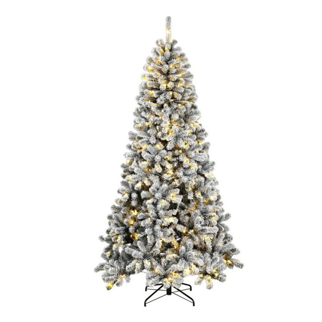 Tall flocked Northern pine with lights