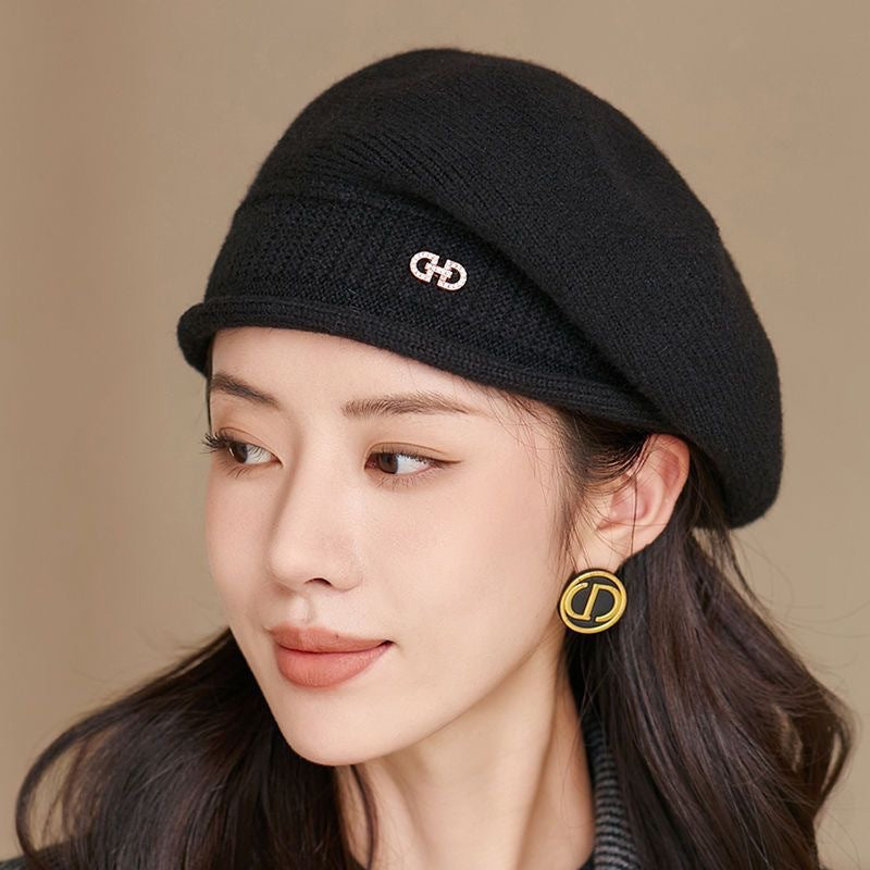 Off-white knitted beret with folded brim