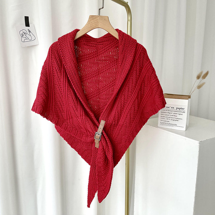 Woman in chunky knit triangle scarf with buckle