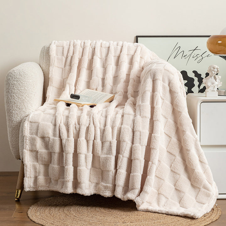 Cream checked plush throw blanket on sofa