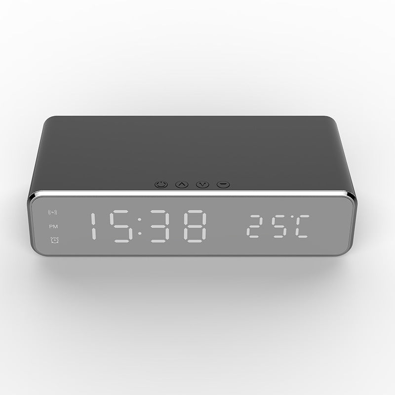 Mirror LED alarm clock charging a phone