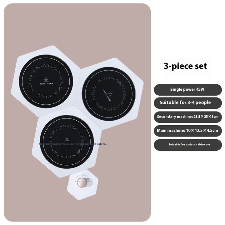 White hexagonal warming plates with dishes on top