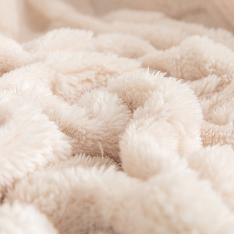 Cream checked plush throw blanket on sofa