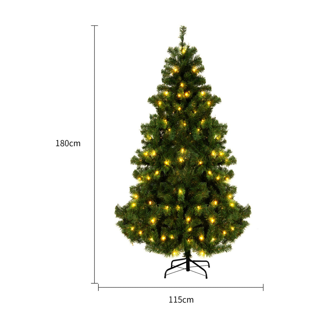 Snow-flocked Christmas tree with warm-white lights