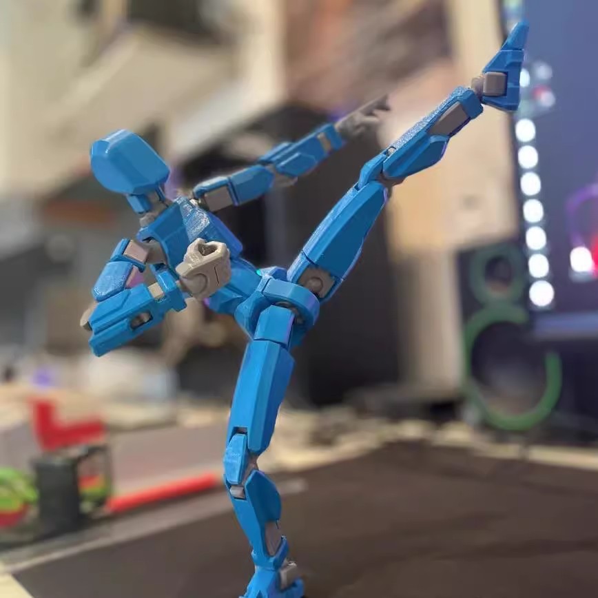 Poseable 3D printed robot figure on desk