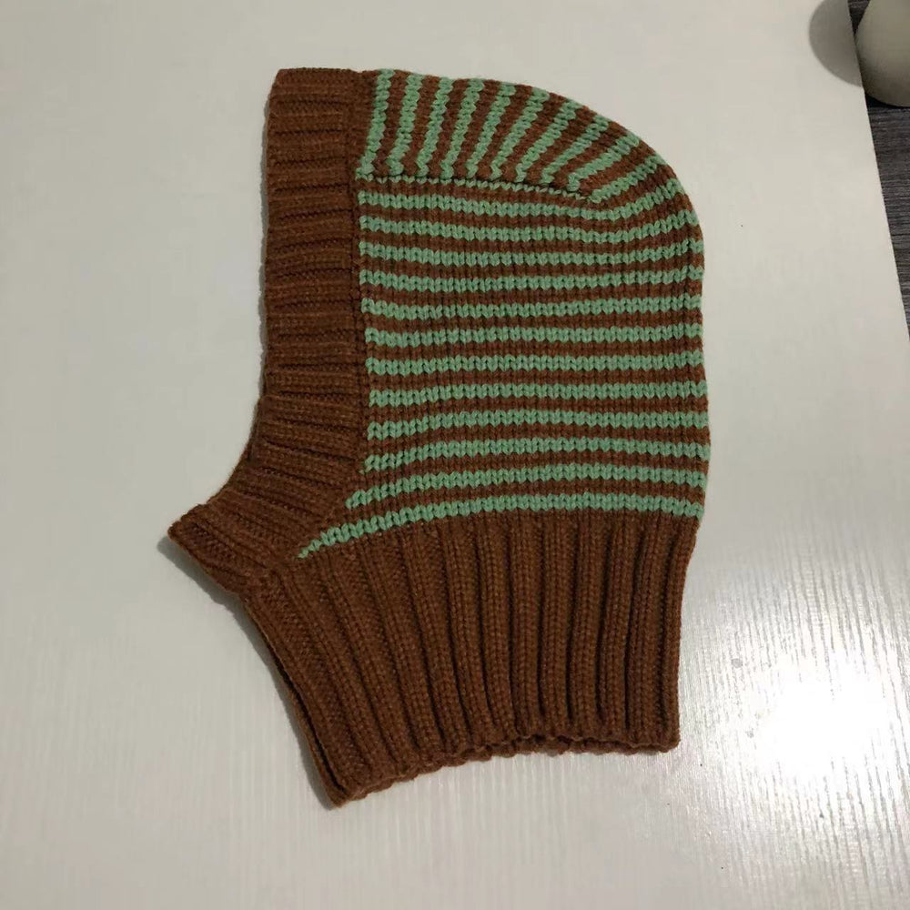 Person wearing striped knitted balaclava hood