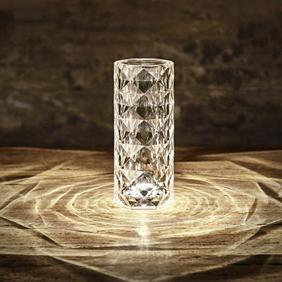 Crystal rose lamp glowing on bedside