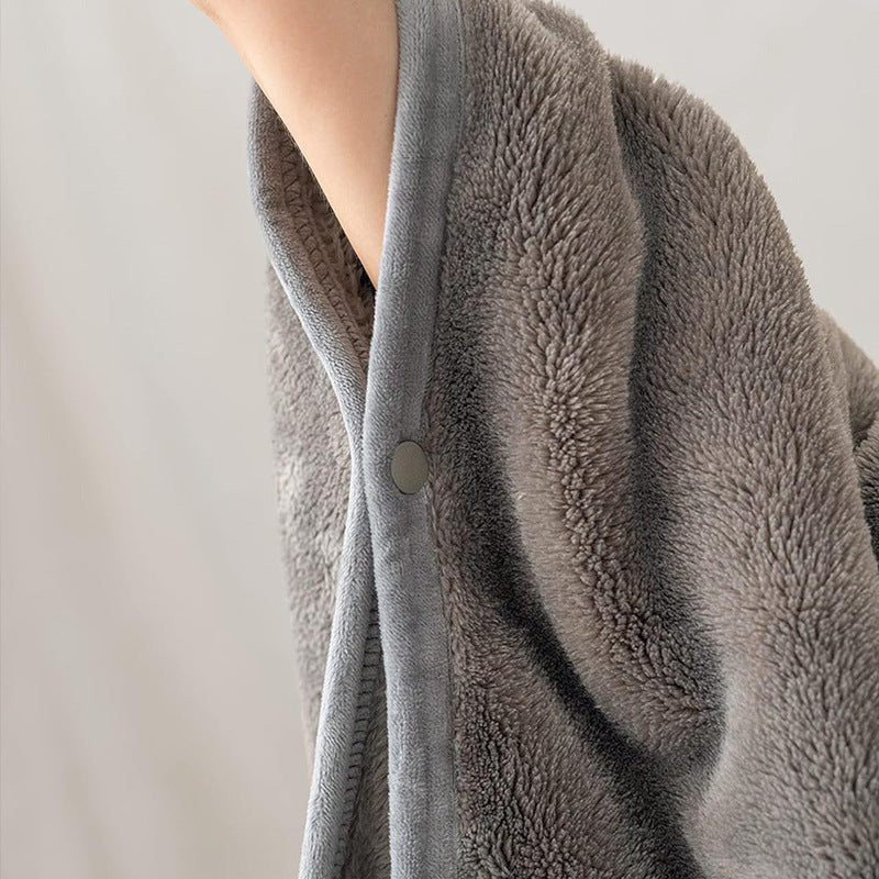 Blue fleece blanket shawl folded into cushion