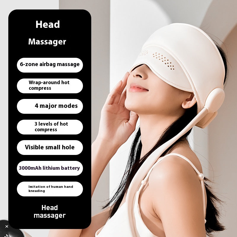 Person wearing hooded head massager wrap