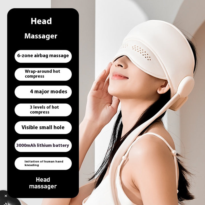 Person wearing hooded head massager wrap