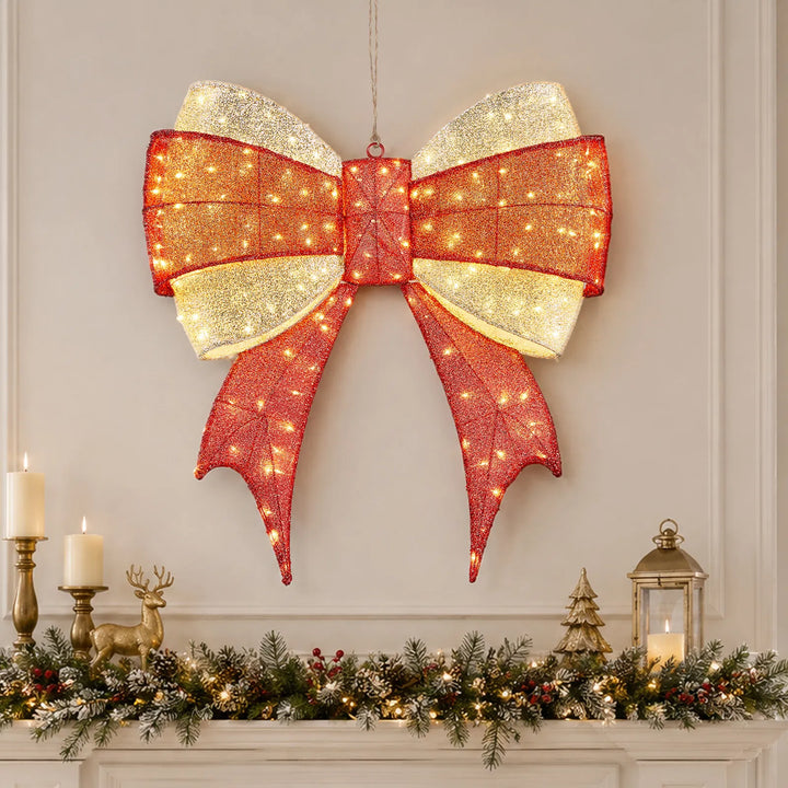Large lit red and gold Christmas bow