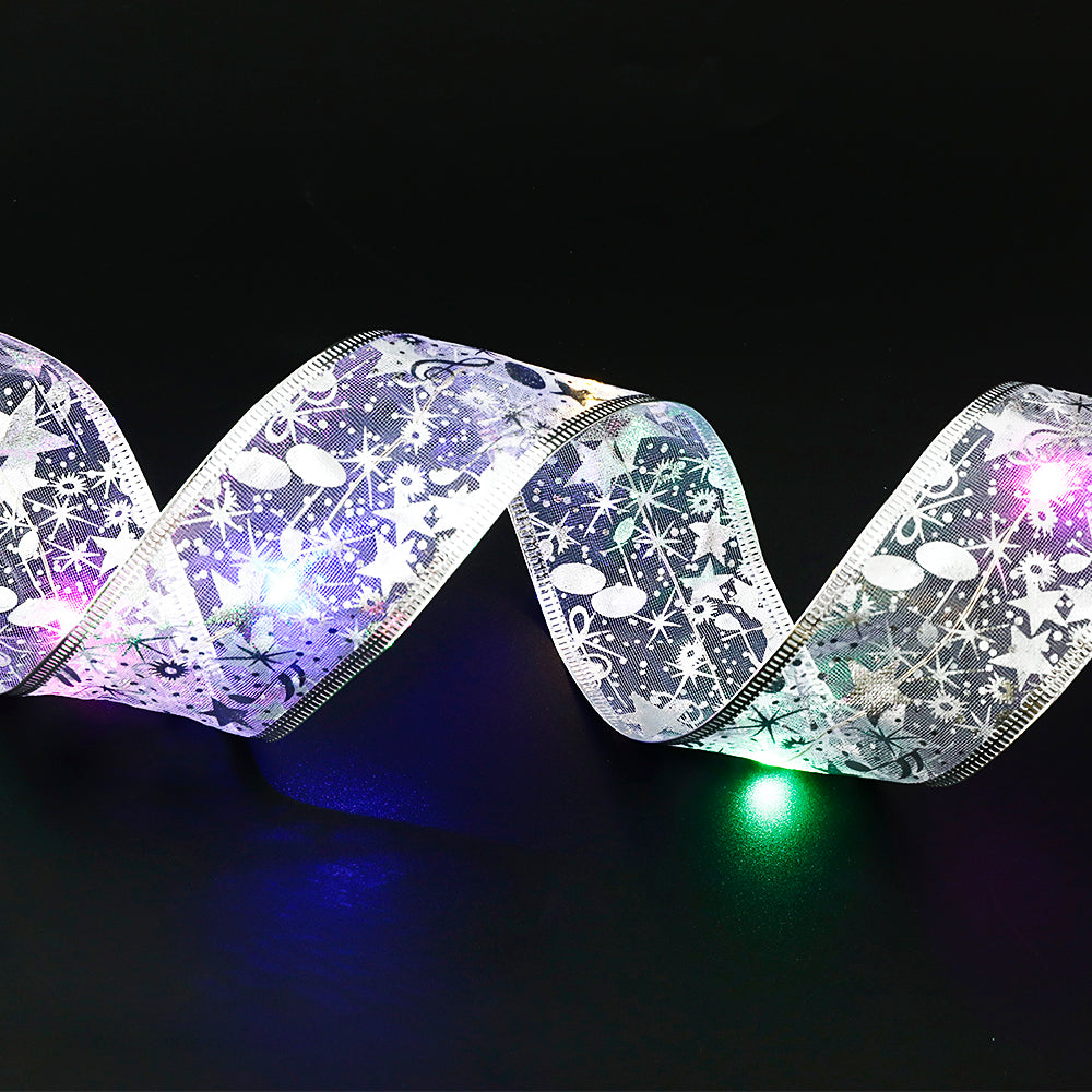 Gold ribbon fairy lights on Christmas tree