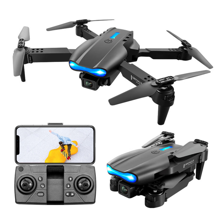 Black foldable drone flying outdoors