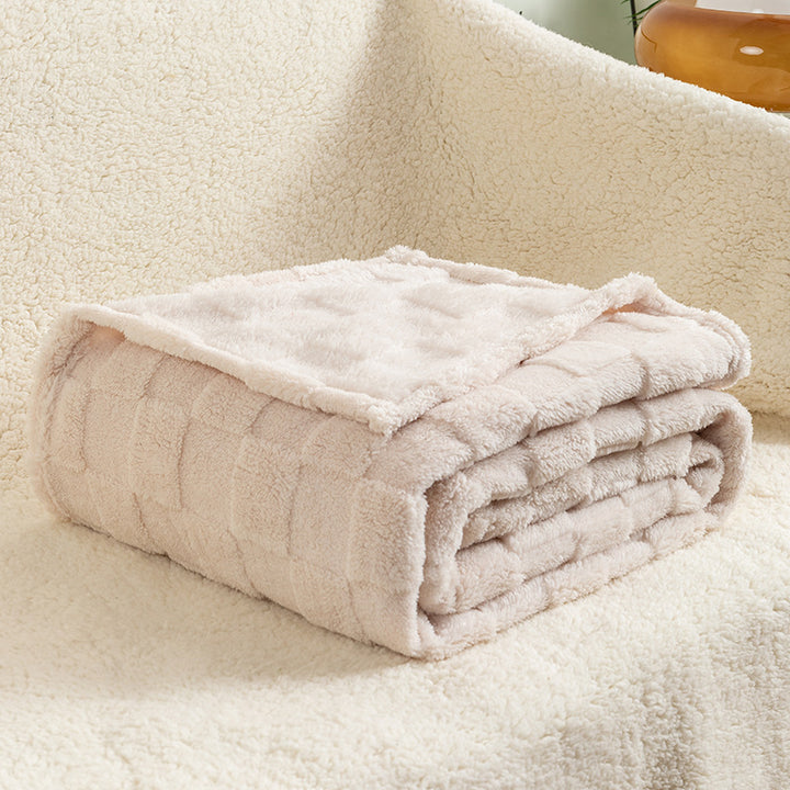 Cream checked plush throw blanket on sofa
