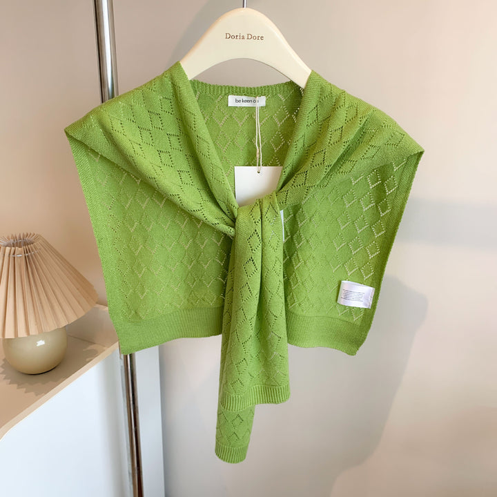 Woman wearing knitted tie front shoulder wrap