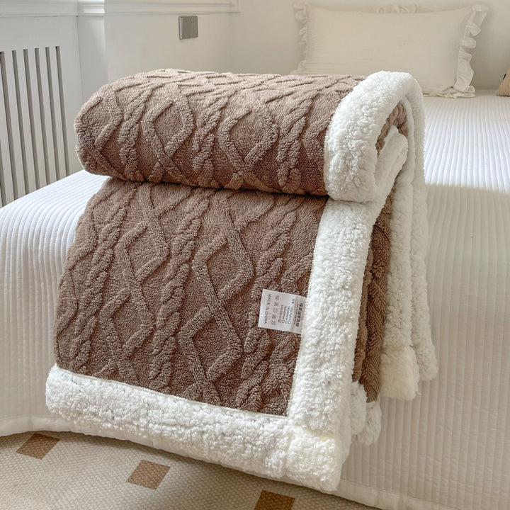 Cream cable knit blanket with sherpa border