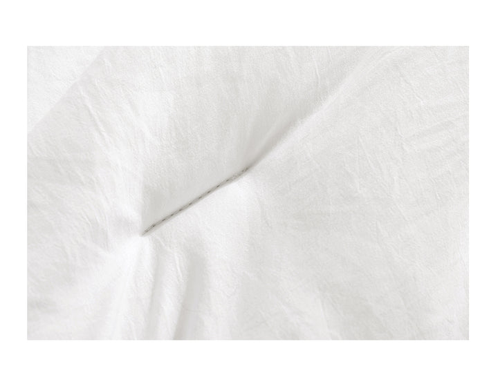 White box-stitched duvet on bed