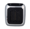 compact grey plug-in heater in a wall socket