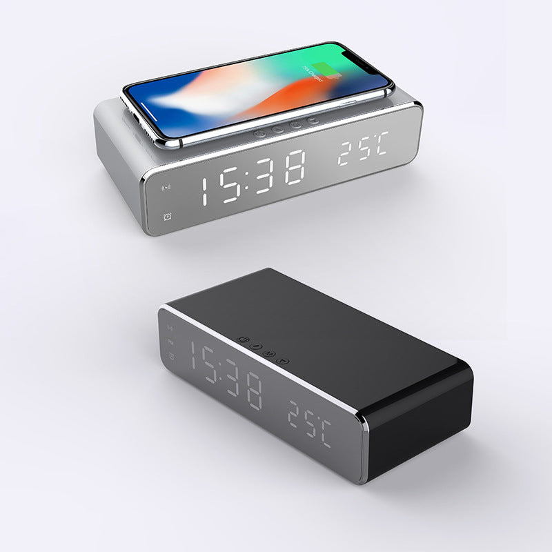 Mirror LED alarm clock charging a phone