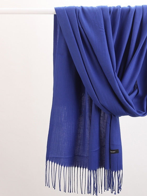 Woman in soft fringed scarf