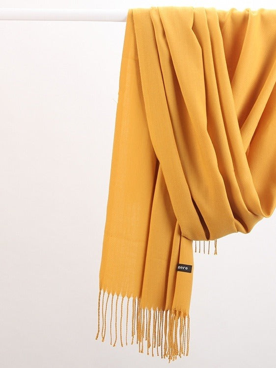 Woman in soft fringed scarf