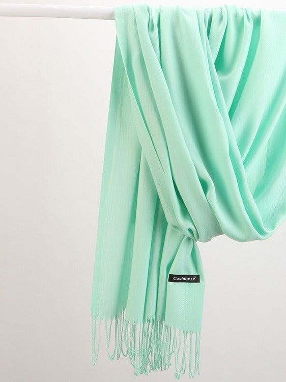 Woman in soft fringed scarf