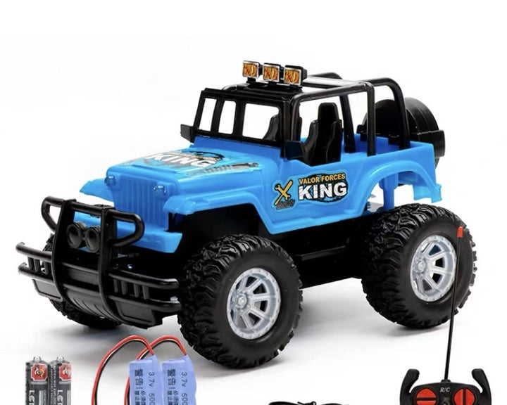 Red remote control jeep on grass