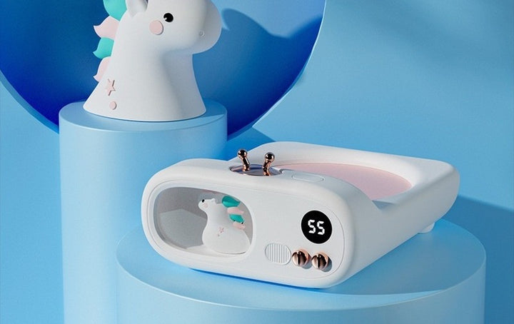 TV shaped mug warmer with unicorn figure