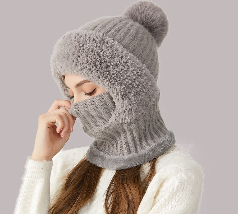 Woman wearing knitted hood with scarf