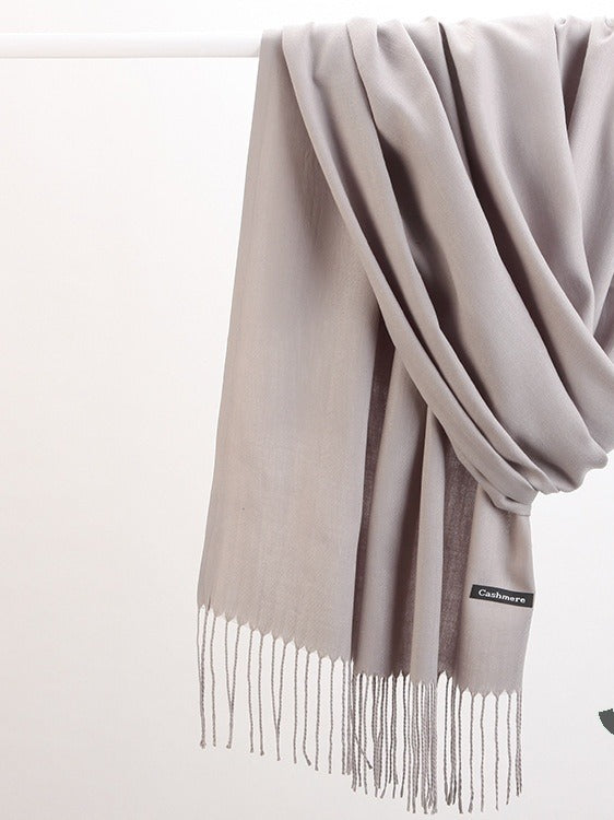 Woman in soft fringed scarf