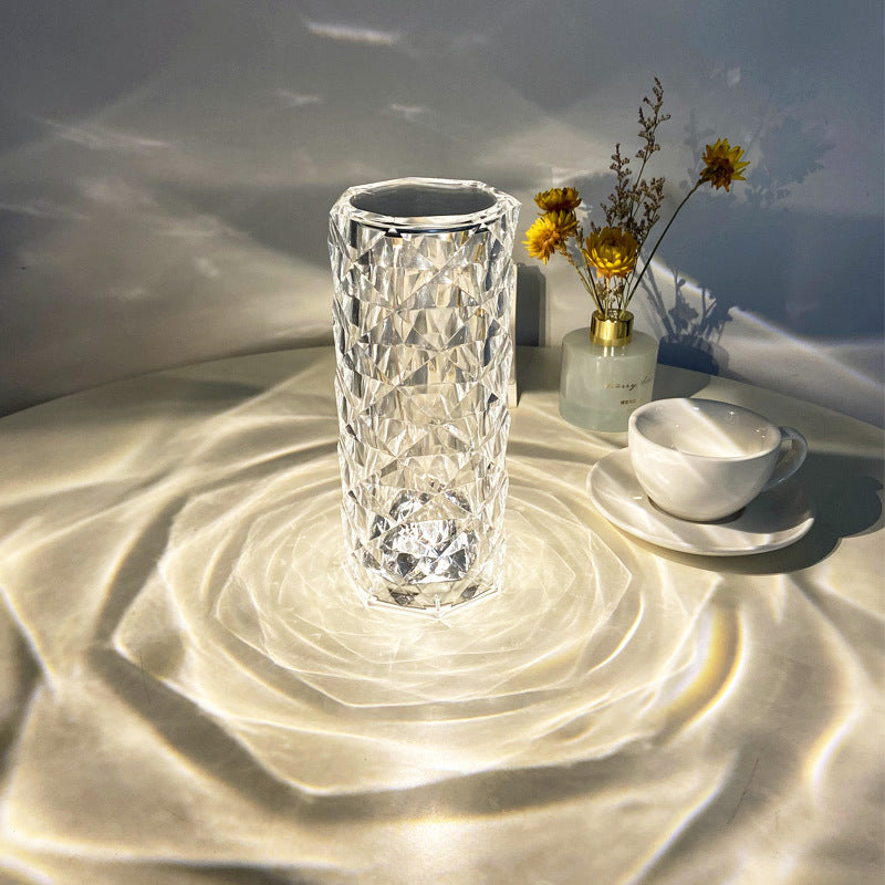 Crystal rose lamp glowing on bedside