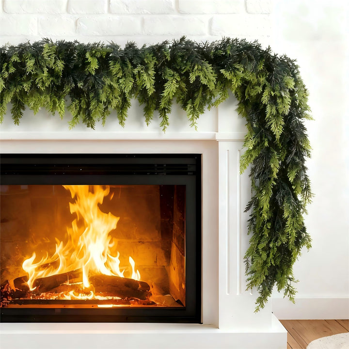 Green Norfolk pine garland on a mantelpiece