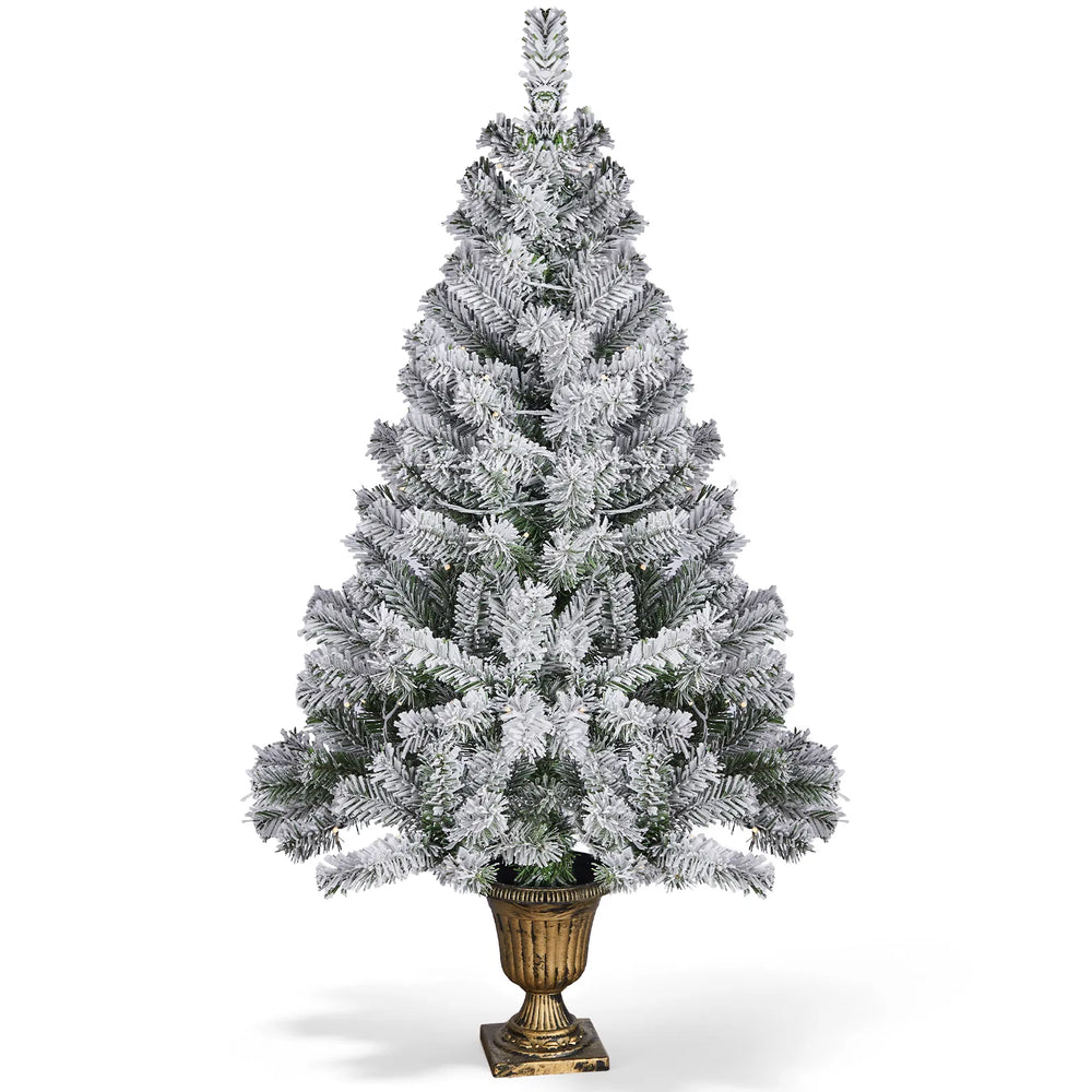 Small flocked tree in a decorative pot