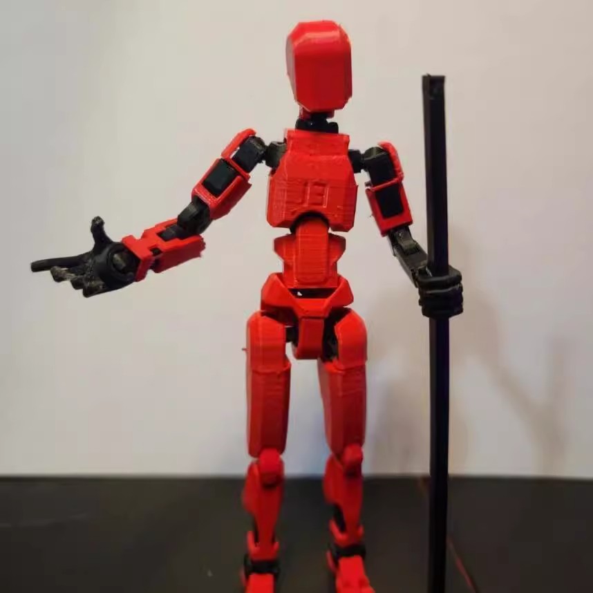 Poseable 3D printed robot figure on desk