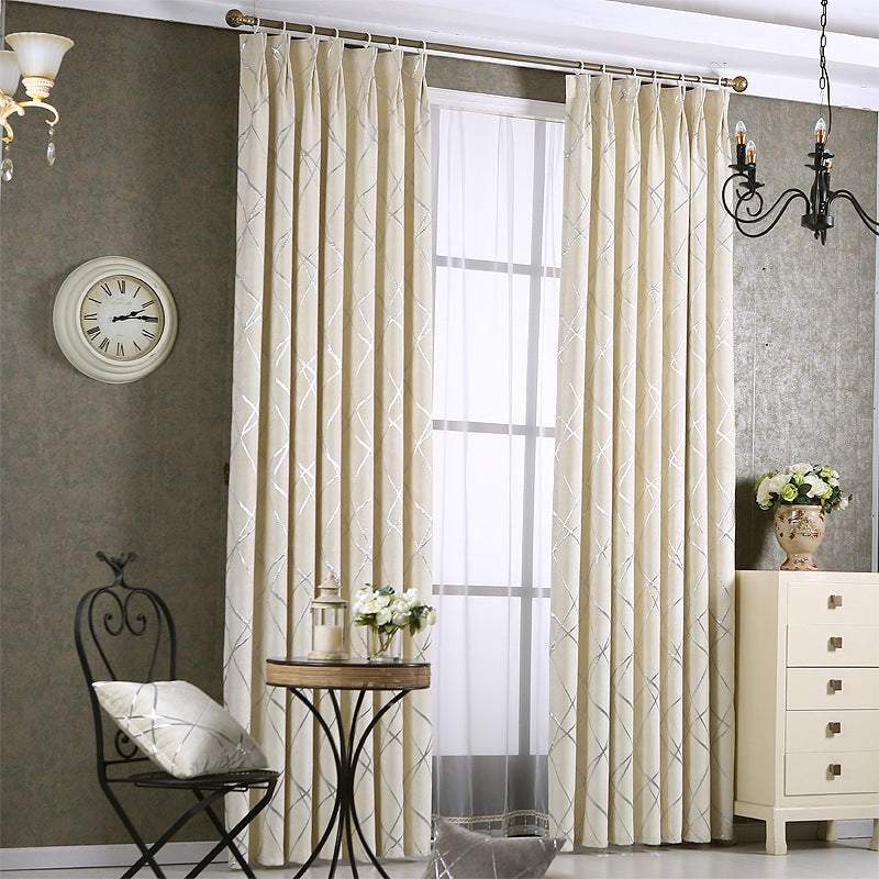 Grey chenille blackout curtain at window
