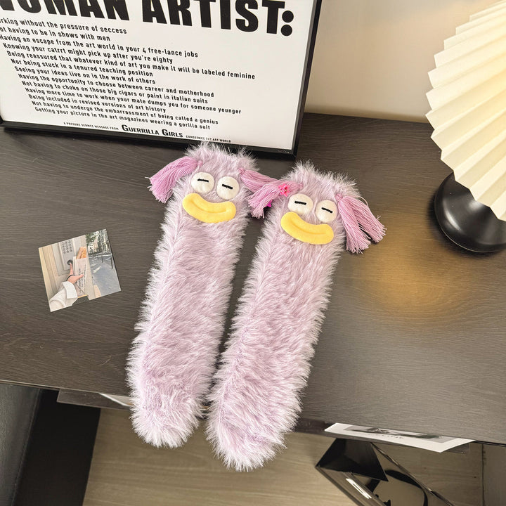 Fluffy socks with googly-eyed monster faces