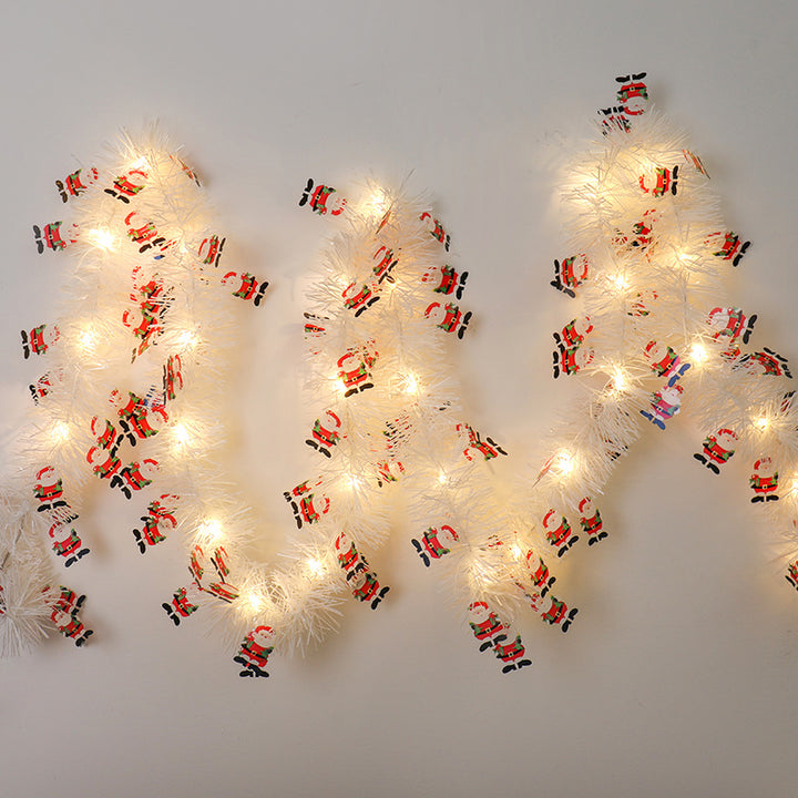 Tinsel Christmas garland with lights and Santas