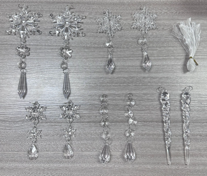 Clear acrylic icicle ornaments hanging on Christmas tree
