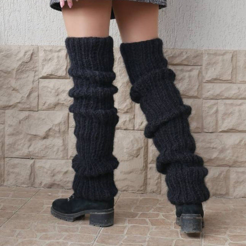 Chunky slouchy knitted leg warmers over boots