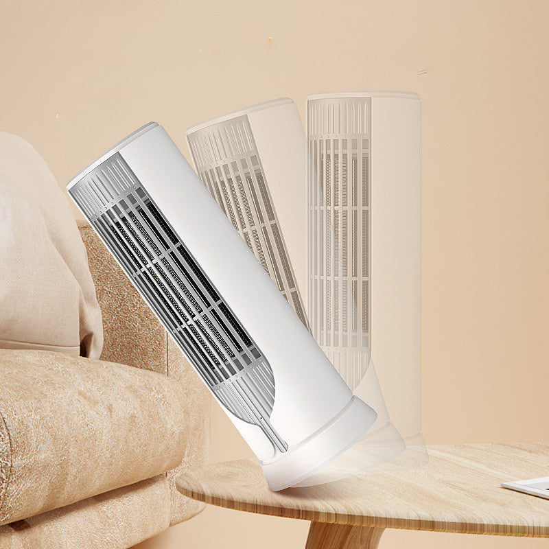 White compact tower fan heater on desk