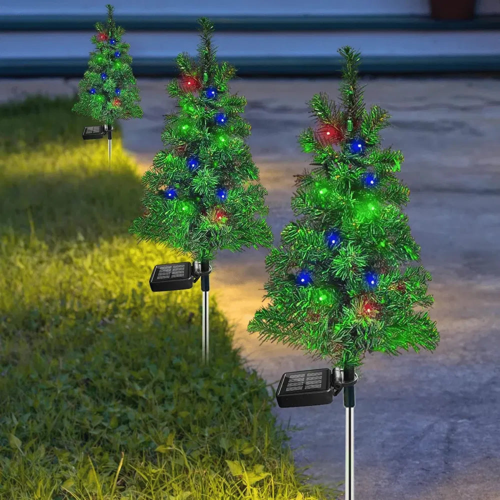 Solar Christmas tree stake lights in garden