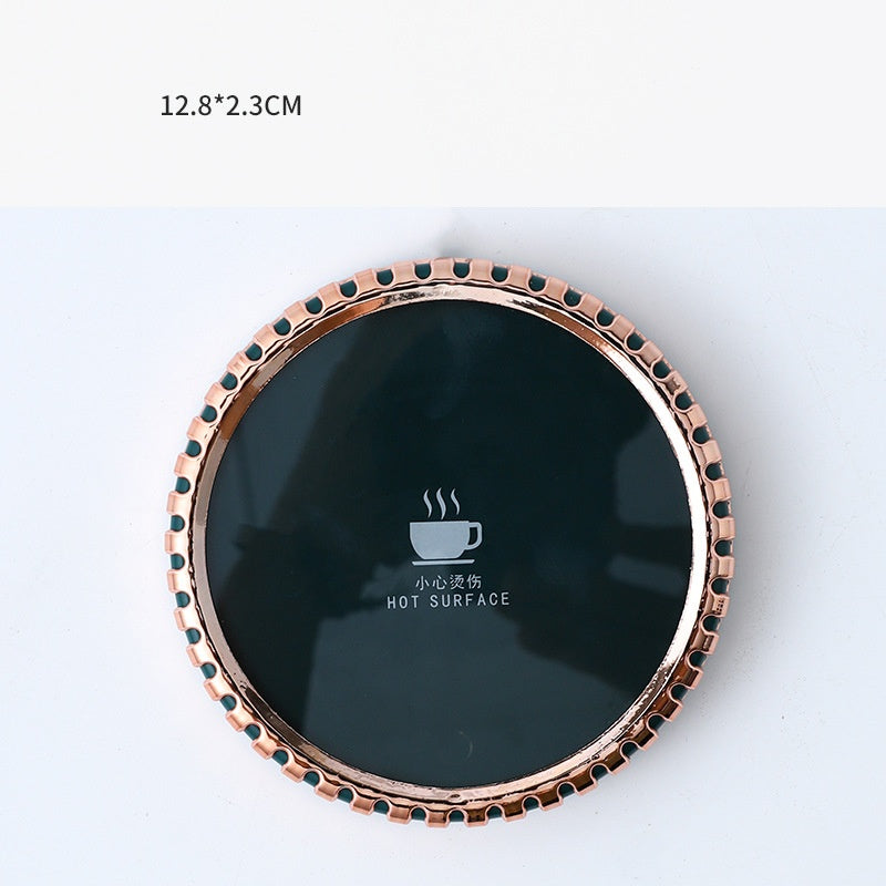 Round mug warmer coaster with mug on top