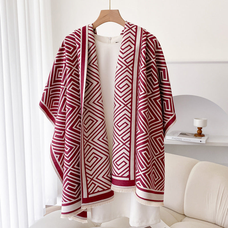Woman wearing grey fringed shawl cape